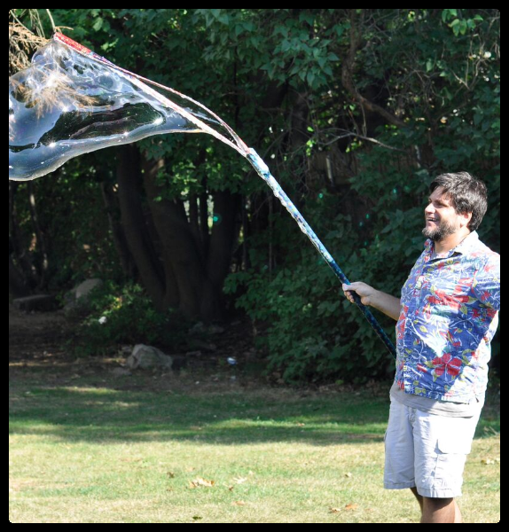 Mr. Vinney using his bubble wand to make a big bubble