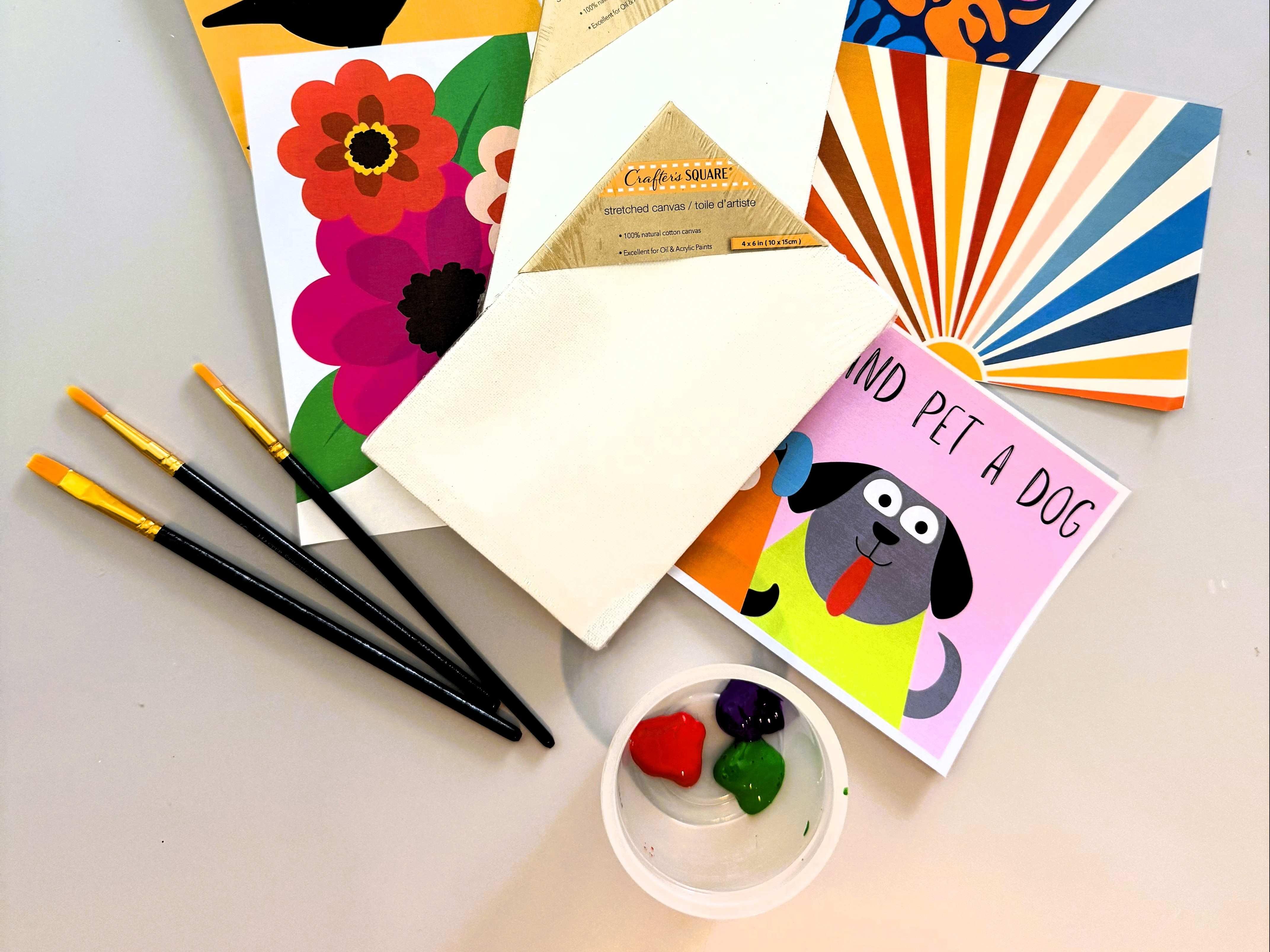Picture of paper with various designs and brushes