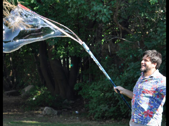 Picture of Mr. Vinney using his bubble want to make a big bubble