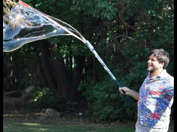 Mr. Vinney using his bubble wand to make a big bubble