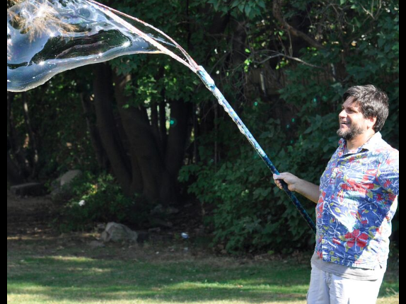 Mr. Vinney using his bubble wand to make a big bubble