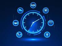 Shutterstock picture of clock with various technology around it.